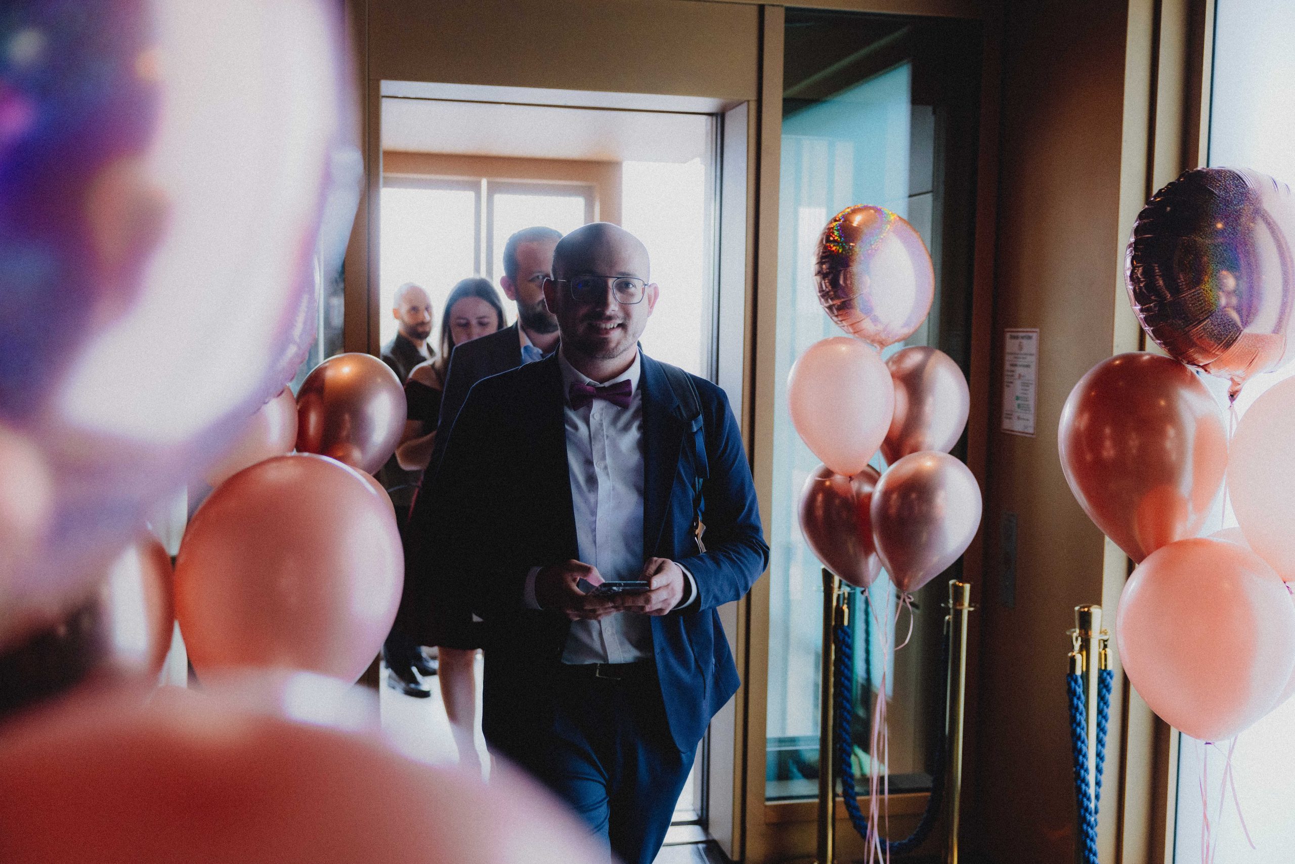 Guests arriving at the gala entrance in evening attire